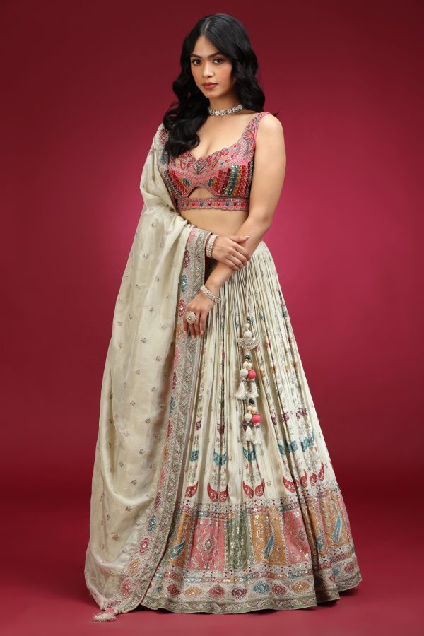 Golden Muslin ivory tissue embroidered lehenga set with rust pink embroidered scalloped-neck blouse and embroidered tissue dupatta