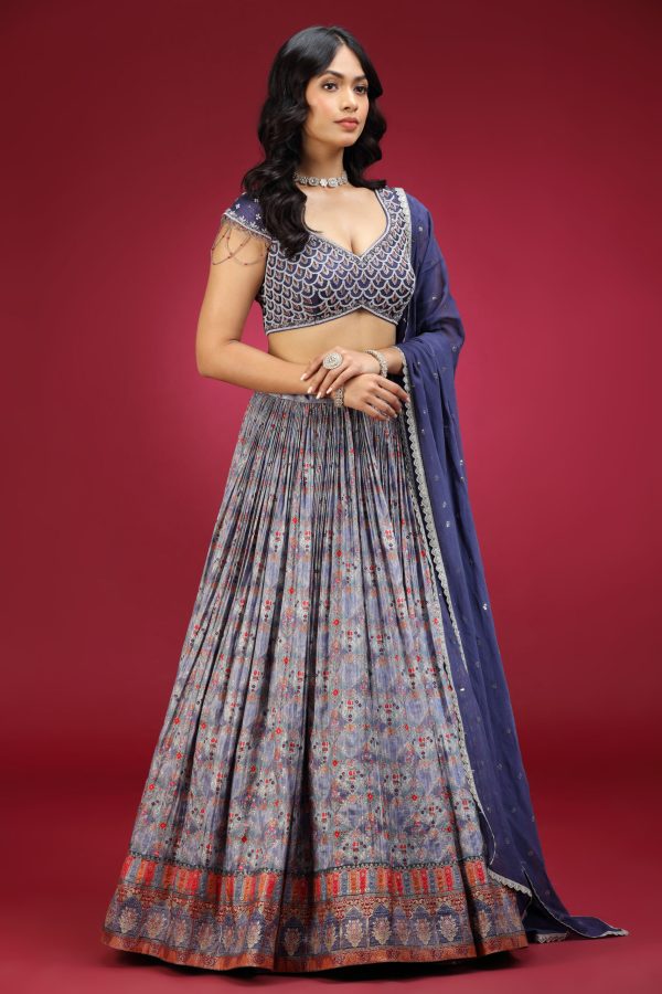 Golden Muslin dull blue crepe embroidered lehenga set with cap-sleeved embroidered blouse