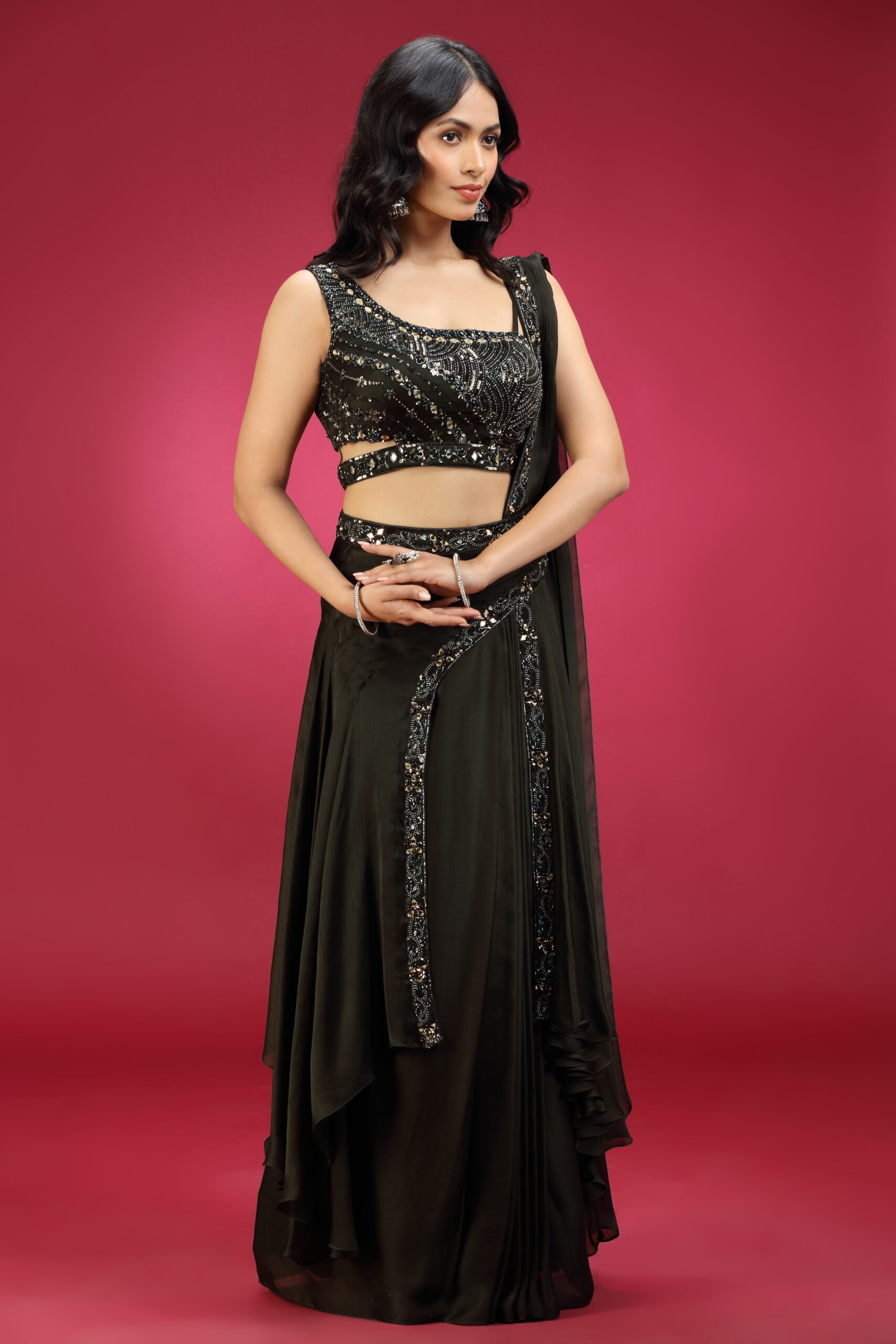 Golden Muslin ebony green poly silk pre-draped embroidered saree with asymmetric neckline blouse and stylish back detailing