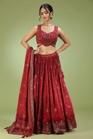 Golden Muslin red crepe bandhani print embroidered lehenga set with sleeveless embroidered blouse