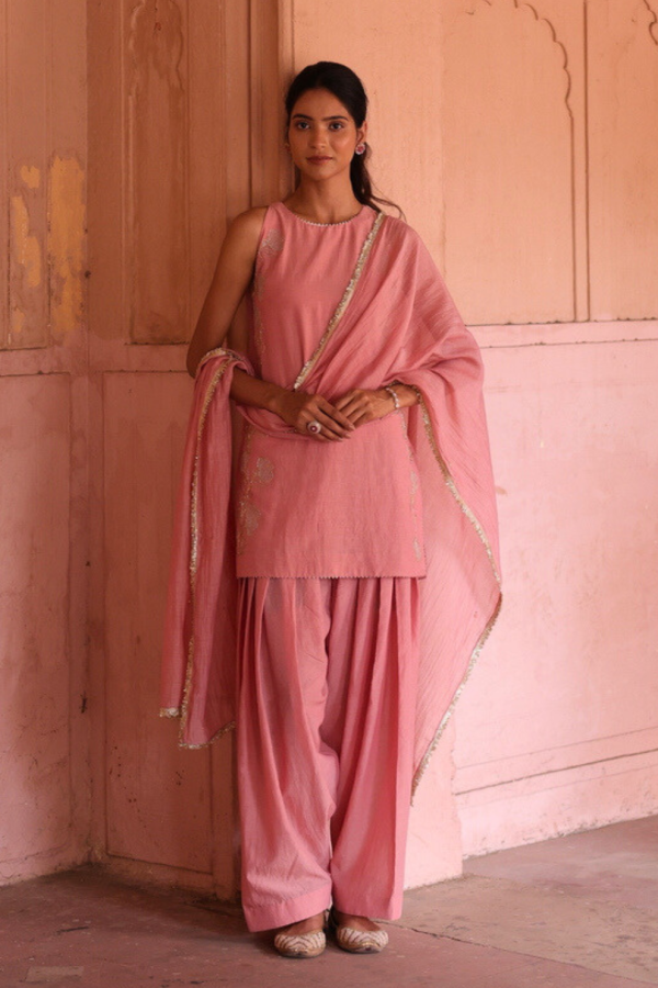 Blush pink pure mul chanderi Farsi salwar suit set by Golden Muslin featuring a sleeveless halter-neck embroidered straight kurta