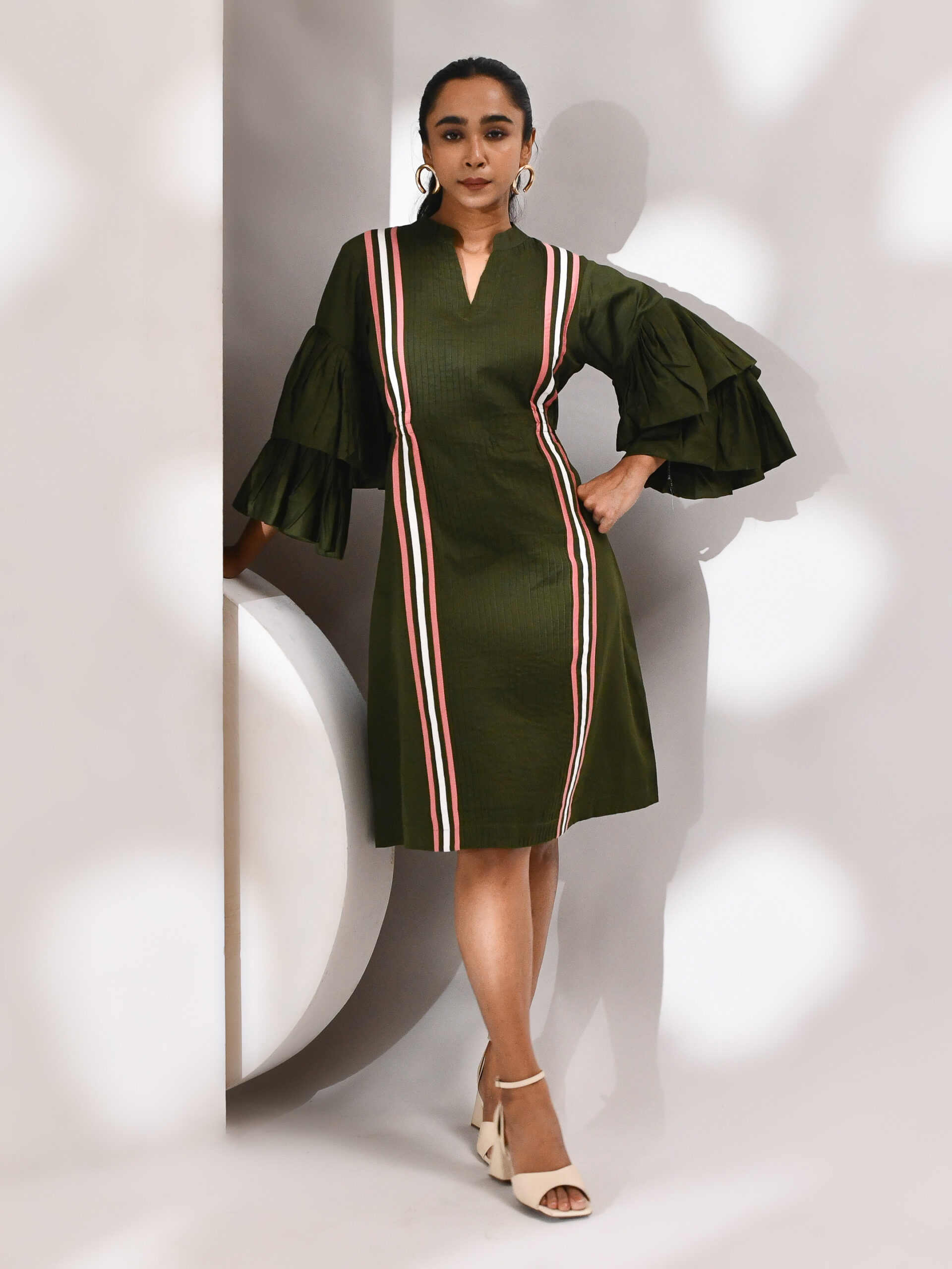Olive green striped cotton dress with side cutouts and flared bell sleeves featuring a sculptural silhouette – Golden Muslin