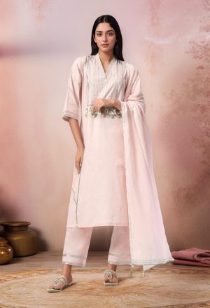 Golden Muslin champagne pink cotton V-neck kurta with gota work on yoke, panels, and sleeves, paired with straight pants and lightweight organza dupatta.
