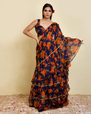 Dark blue and orange pre-draped floral printed chiffon saree with lace detailing and sleeveless padded blouse in Golden Muslin by Priyanka Rathore