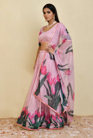 Floral print pink chanderi pleated lehenga with lace borders and chiffon dupatta from Golden Muslin by Priyanka Rathore.