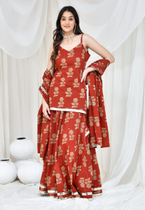 Golden Muslin rust red printed cotton kurta set with gota lace detailing by Priyanka Rathore
