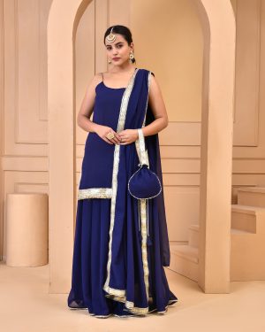 Navy blue georgette sharara set with short solid kurta featuring gota noodle straps, delicate embellishments, matching sharara, coordinated dupatta with gota accents, and complementary potli in Golden Muslin by Priyanka Rathore