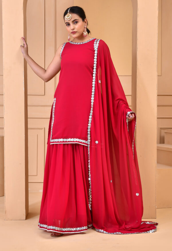 Red georgette embroidered sharara set with short kurta featuring sequin embroidery, matching sharara, and coordinated dupatta with butti motifs and embroidered border in Golden Muslin by Priyanka Rathore