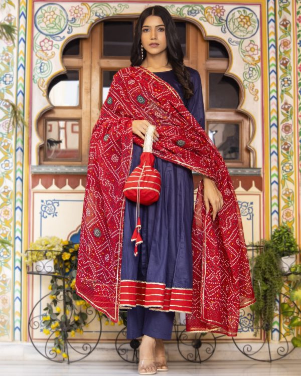 Navy blue cotton silk Anarkali set in Golden Muslin by Priyanka Rathore with gota detailing, bandhej mulmul dupatta, and potli