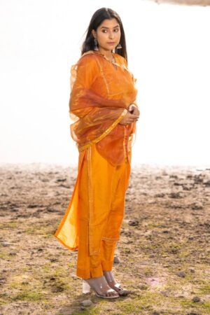Mustard Jam cotton silk suit set with aari embroidered kurta, pants and dupatta from Golden Muslin by Priyanka Rathore