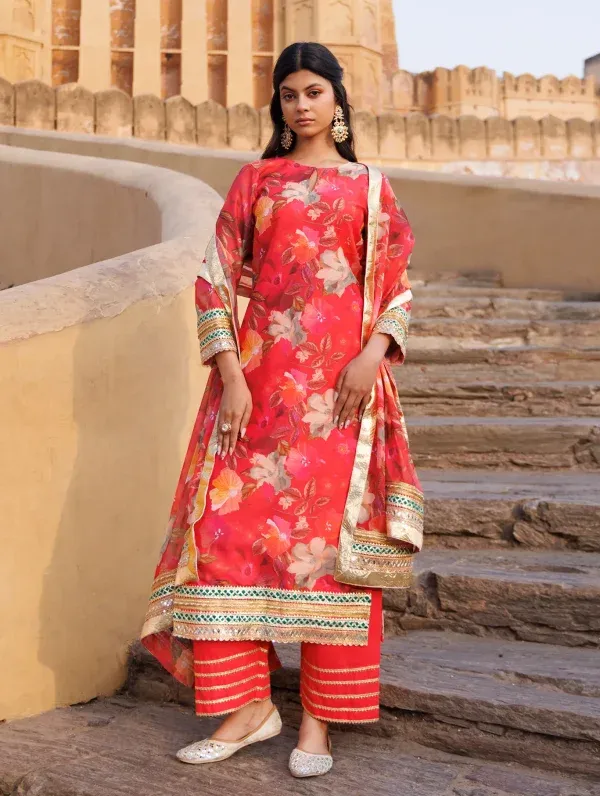 Coral Chanderi kurta set with floral prints, gota accents and subtle sequins from Golden Muslin by Priyanka Rathore
