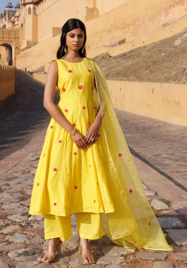 Yellow Chanderi kurta set with handcrafted aari embroidered floral motifs and subtle sheen from Golden Muslin by Priyanka Rathore
