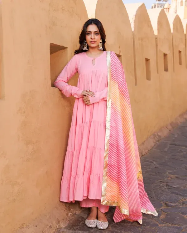 Soft pink cotton tiered Anarkali set with flowy silhouette and graceful movement from Golden Muslin by Priyanka Rathore