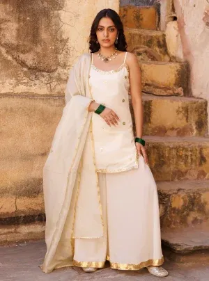 Ivory crepe sharara set with strappy kurta and delicate sequin lace detailing from Golden Muslin by Priyanka Rathore