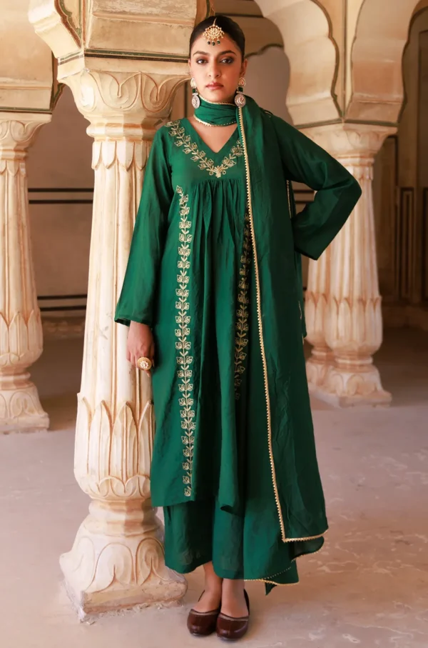 Emerald green Chanderi kurta set with intricate aari embroidery and fluid silhouette from Golden Muslin by Priyanka Rathore