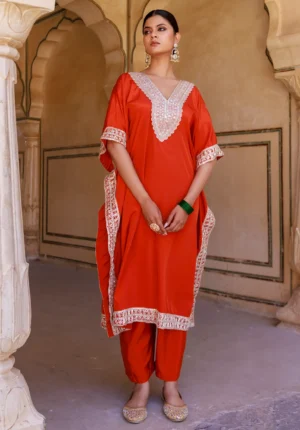 Brunt orange kaftan and palazzo set with lace-embellished yoke and border detailing from Golden Muslin by Priyanka Rathore