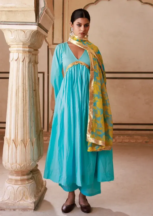 Turquoise cotton Anarkali set with V-neck, soft flare and subtle gota lace detailing from Golden Muslin by Priyanka Rathore