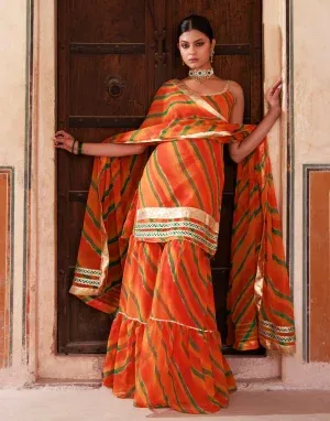 Orange chiffon sharara set with strappy kurta, gota accents and sequin lace borders from Golden Muslin by Priyanka Rathore