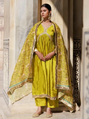 Green Uppada silk kurta set with delicate gota and lace work and subtle sheen from Golden Muslin by Priyanka Rathore