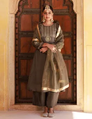 Green Uppada silk kurta set with delicate aari embroidery and classic silhouette from Golden Muslin by Priyanka Rathore